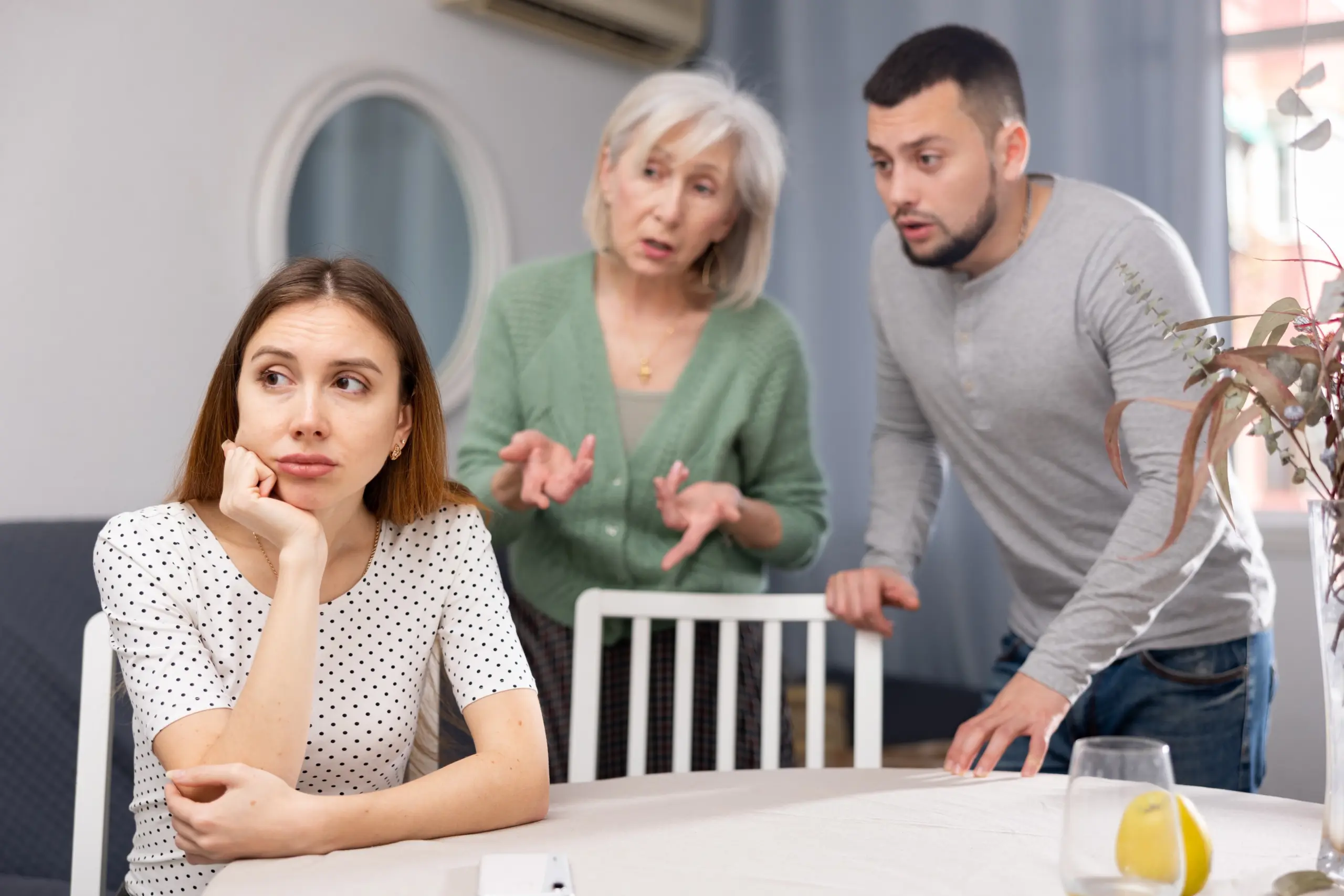 young person sitting apart from family showing signs of withdrawal