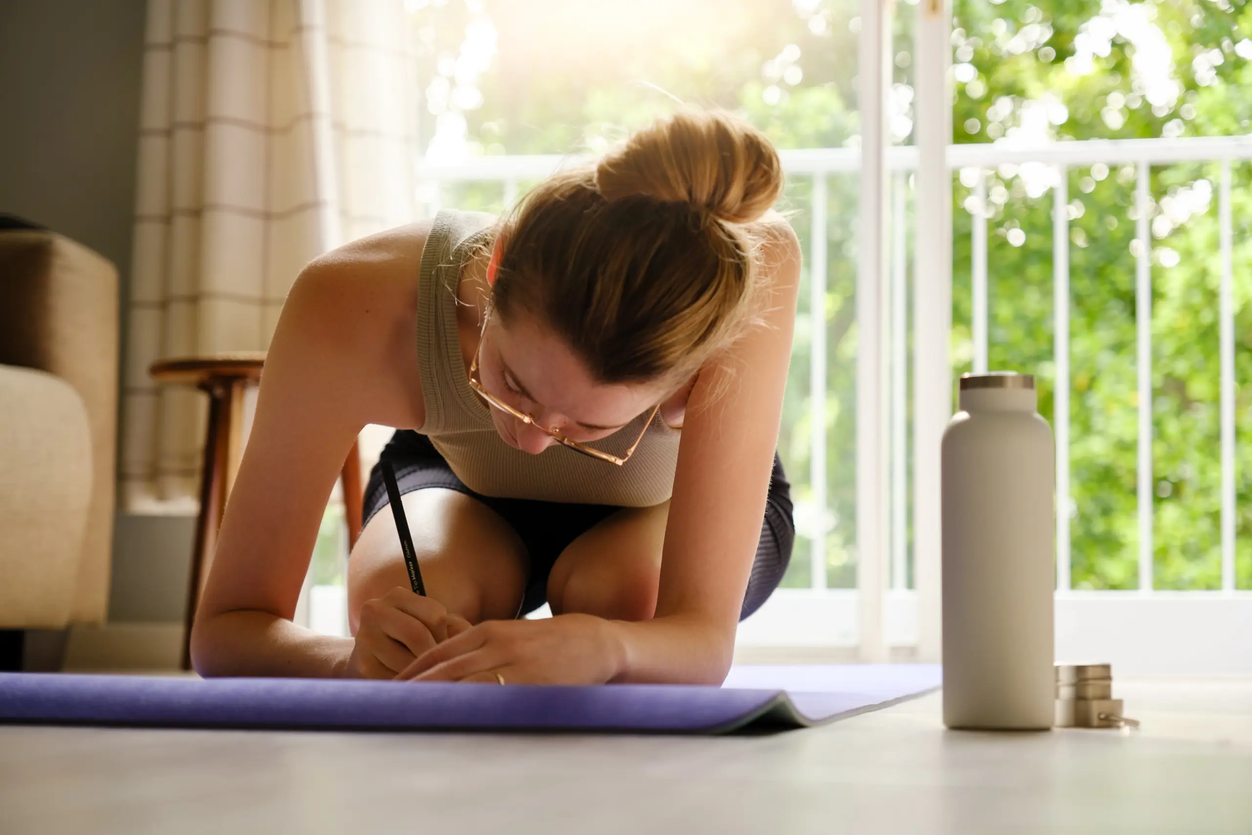 Recovery tools like a journal, water bottle, and meditation app