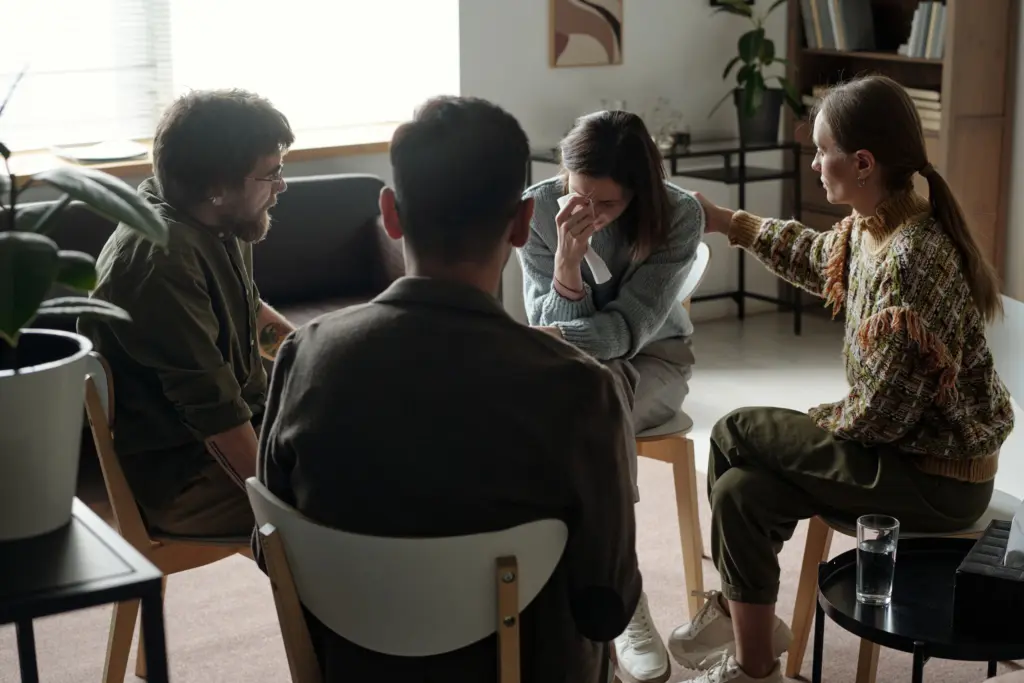 young adults participating in group therapy at a recovery center