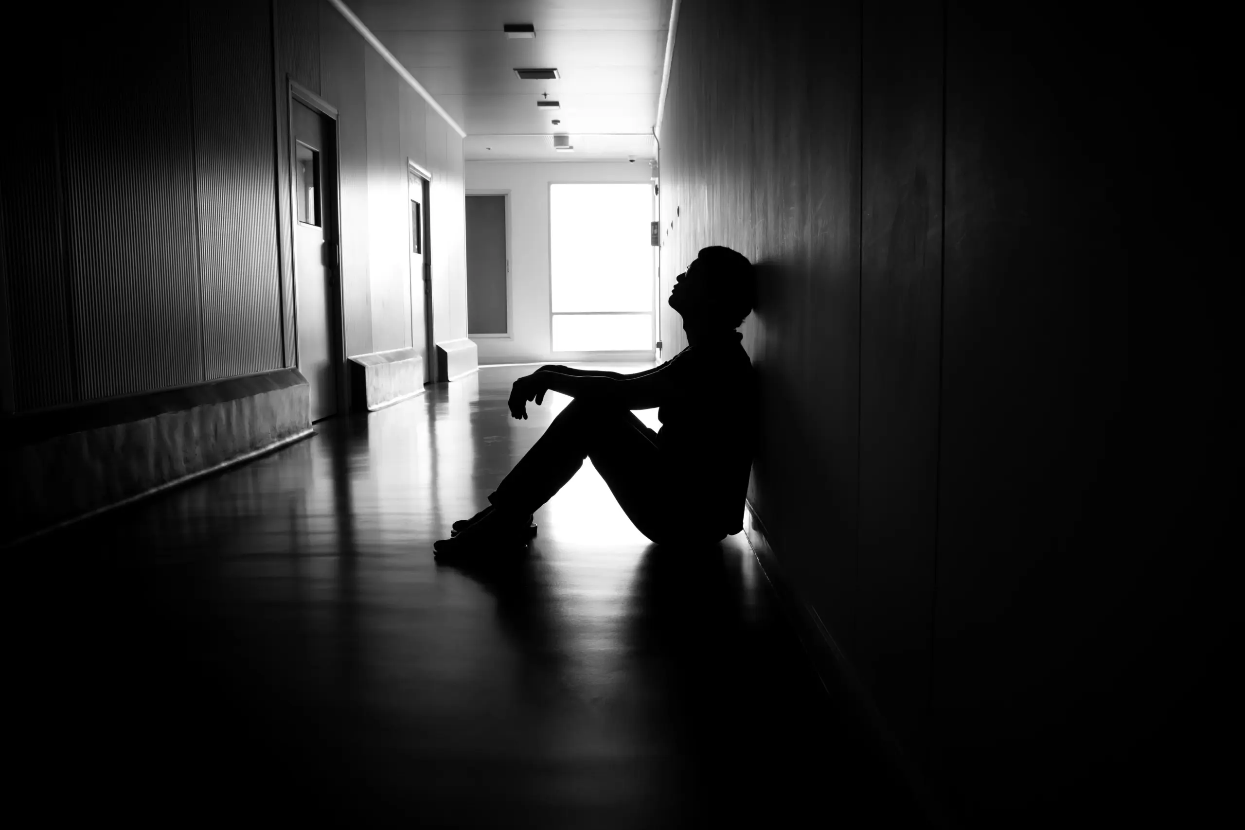 Person overwhelmed by stress and emotional triggers, symbolizing how chronic stress affects the brain and increases addiction risk