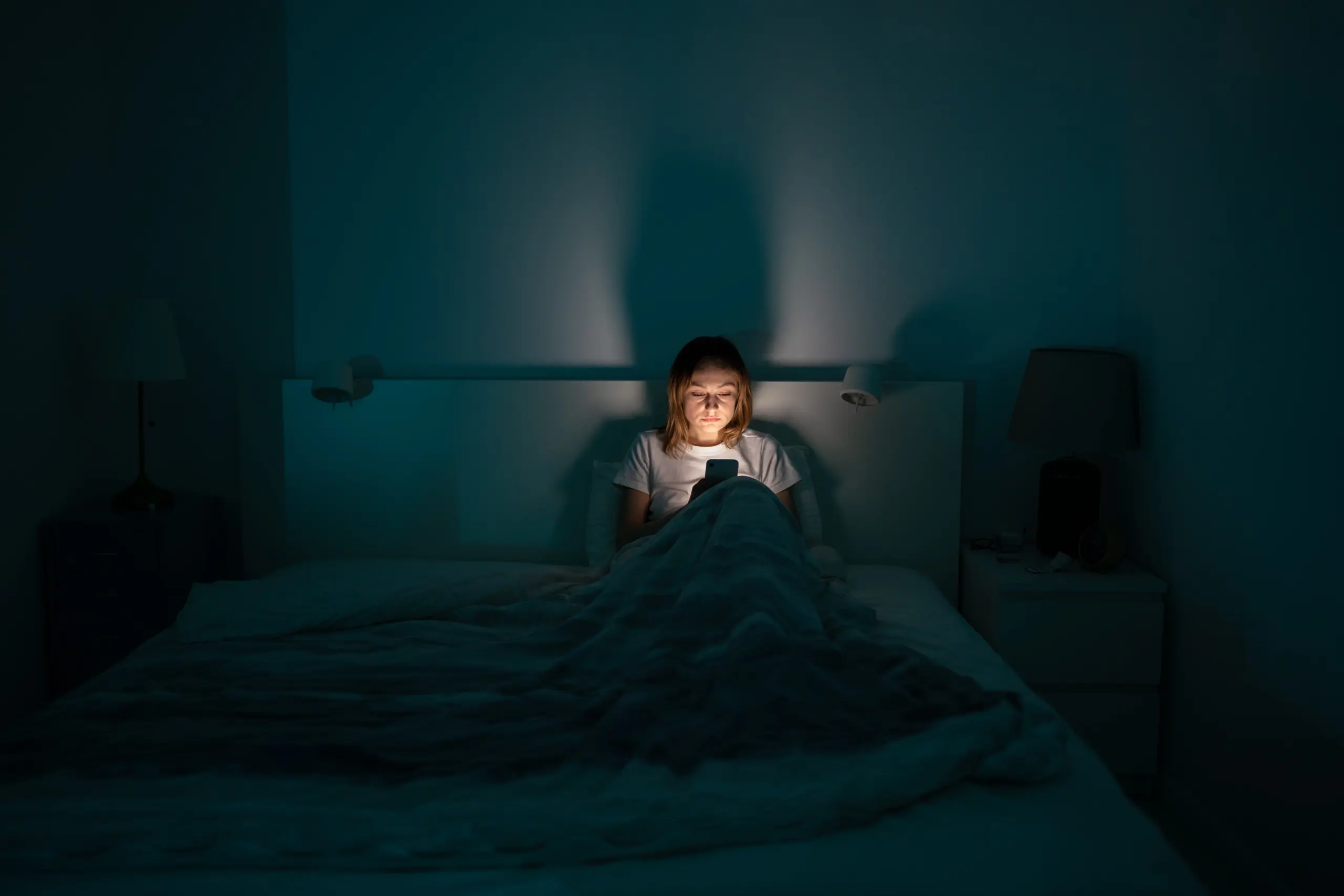 Individual showing signs of internet and social media addiction at night