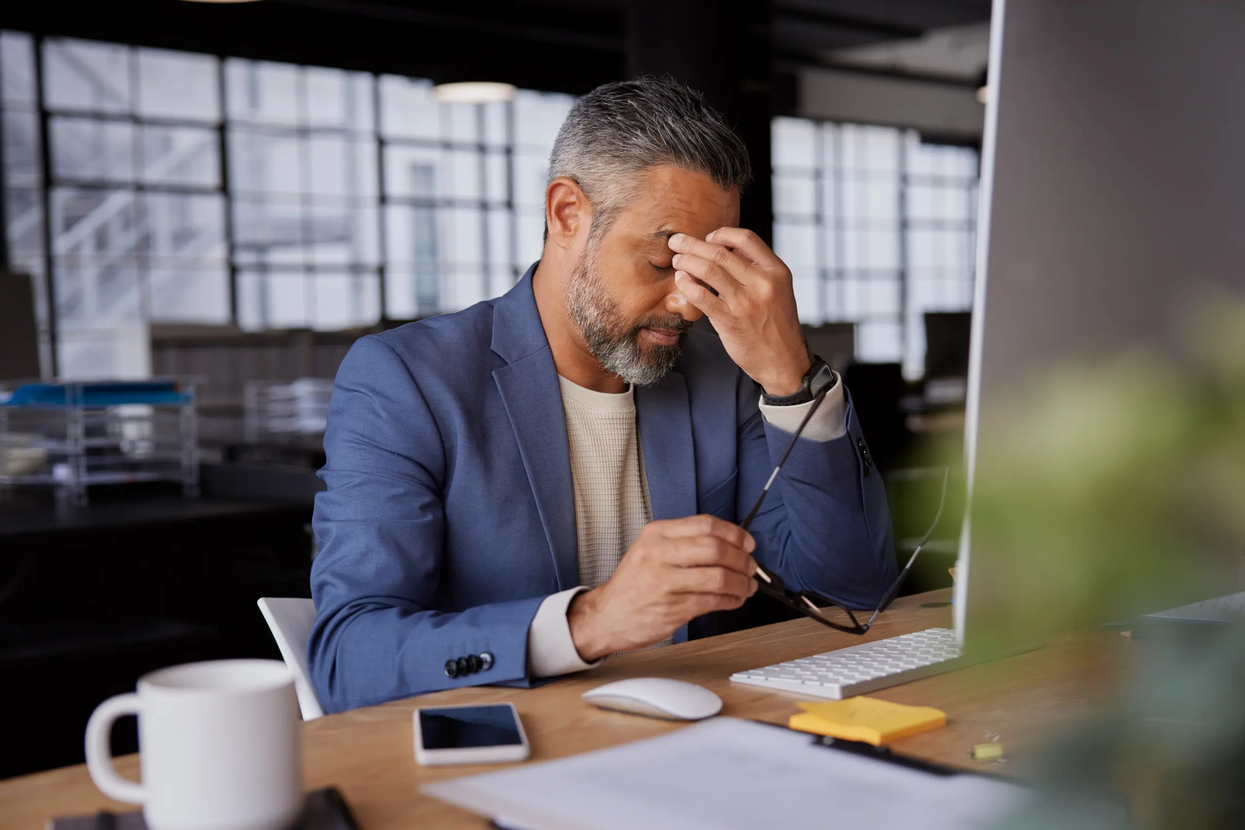 Professional showing hidden stress while struggling with high-functioning addiction