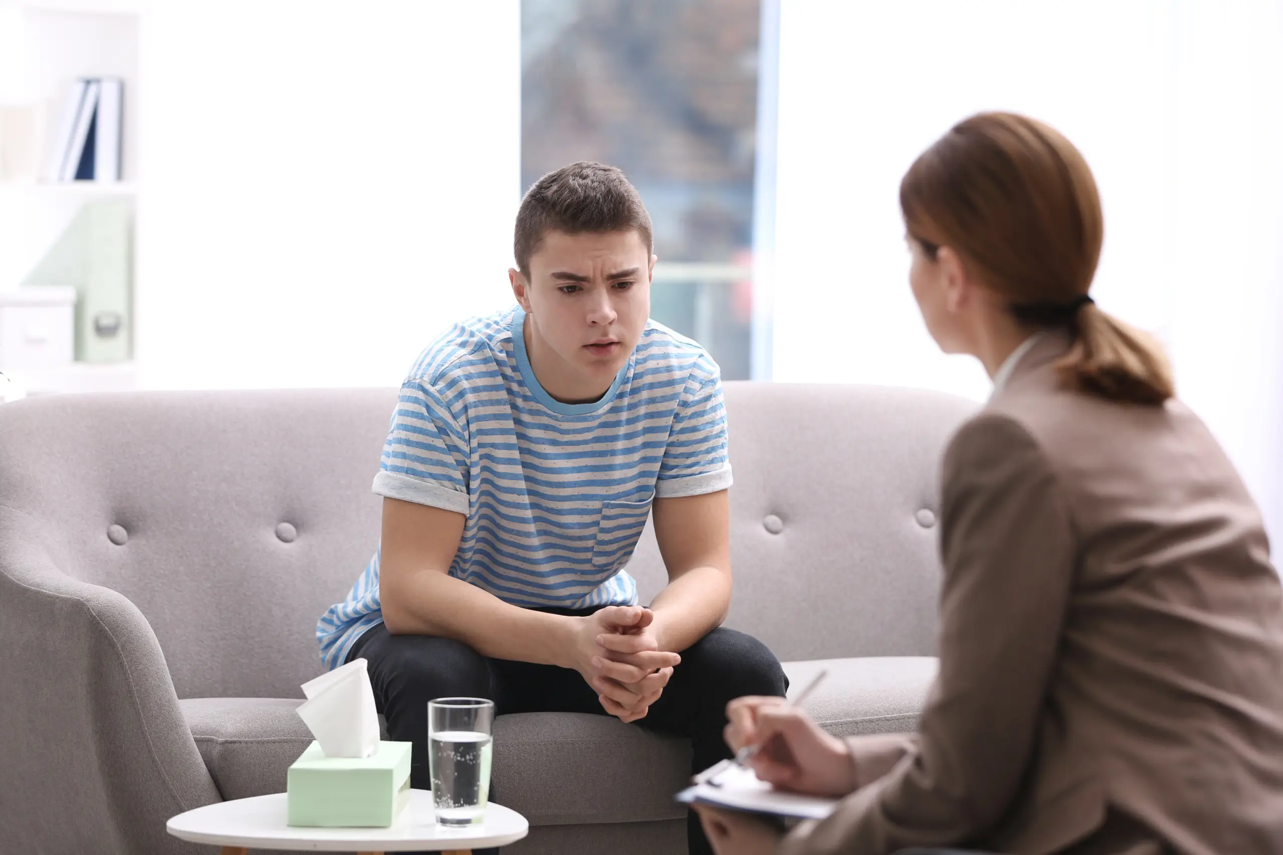 Teen receiving therapy to address effects of an alcoholic parent