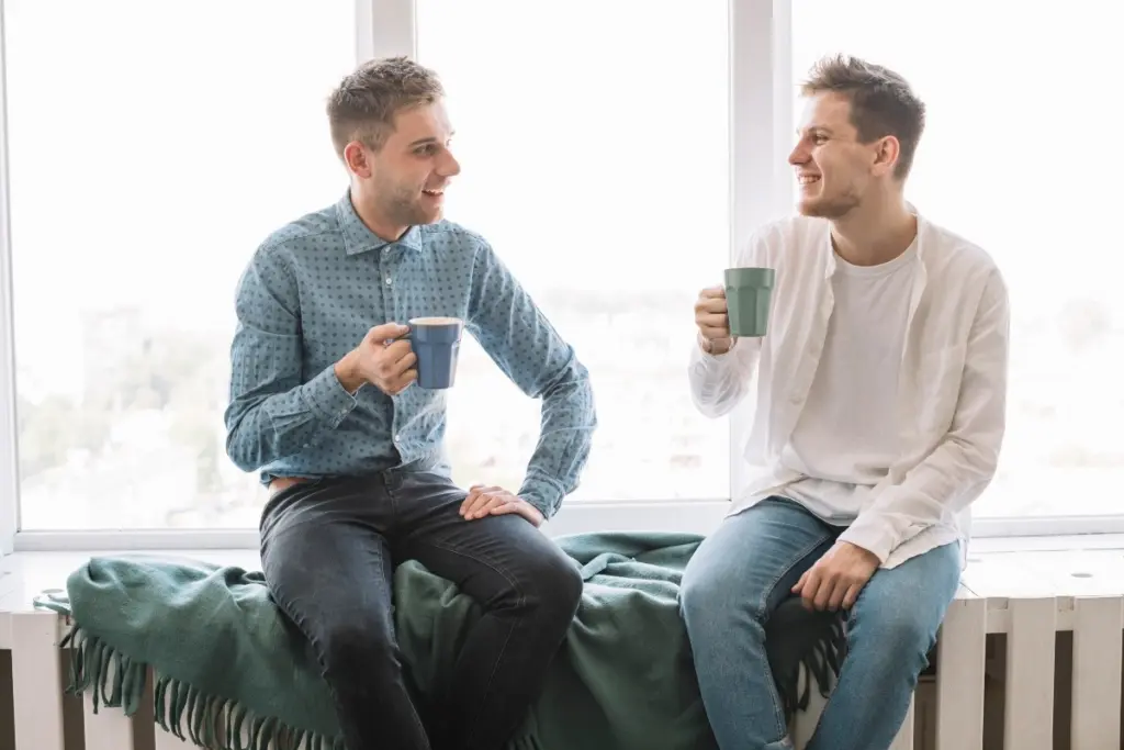 Two friends having a conversation as part of their sober living.