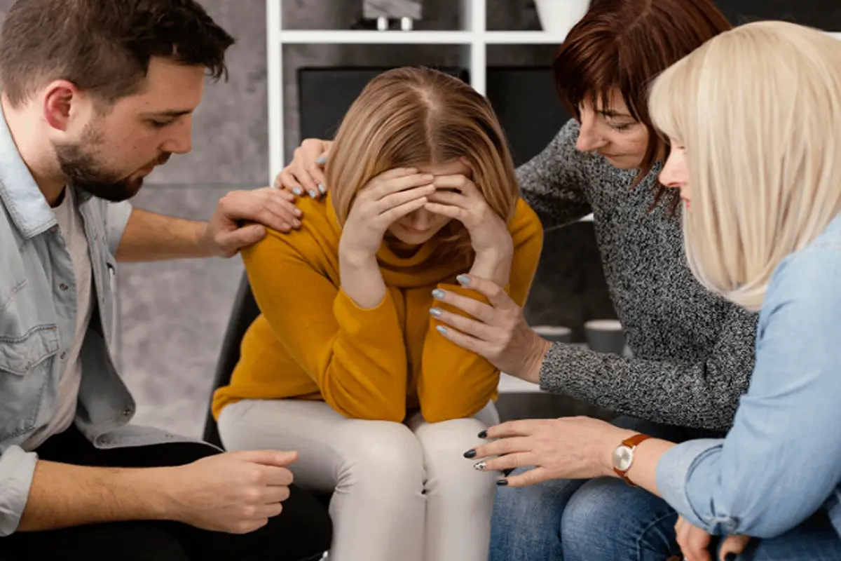 Family members helping a loved one in rehab.