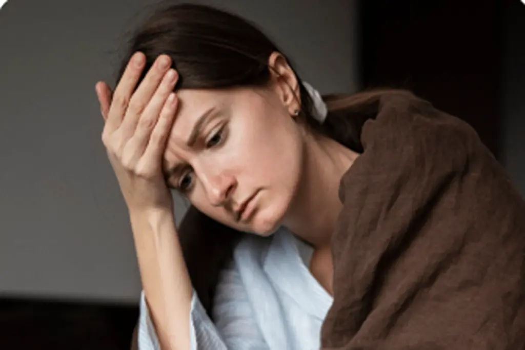 Woman experiencing withdrawal during rehab