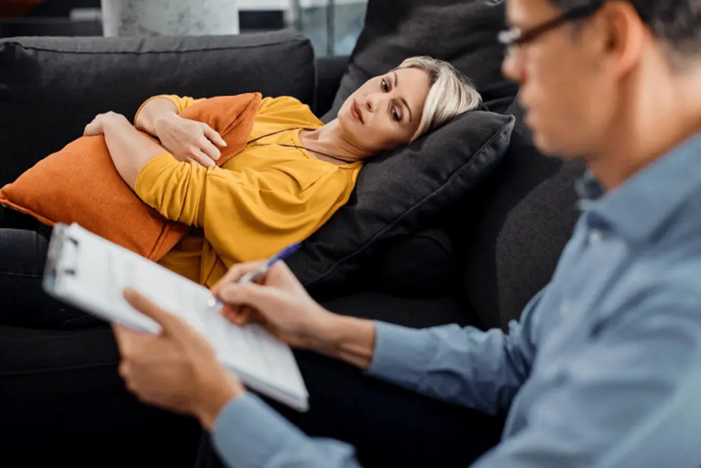 Woman talking to the psychotherapist about her mental health problems