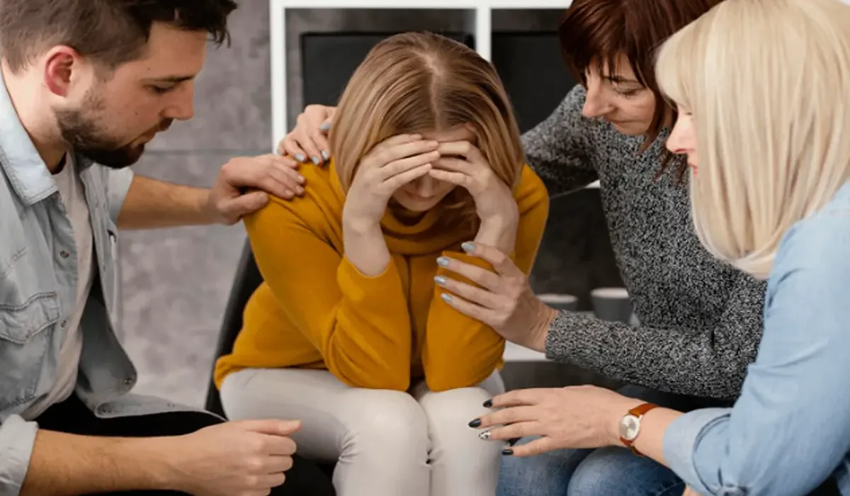 Family members helping a loved one in rehab.